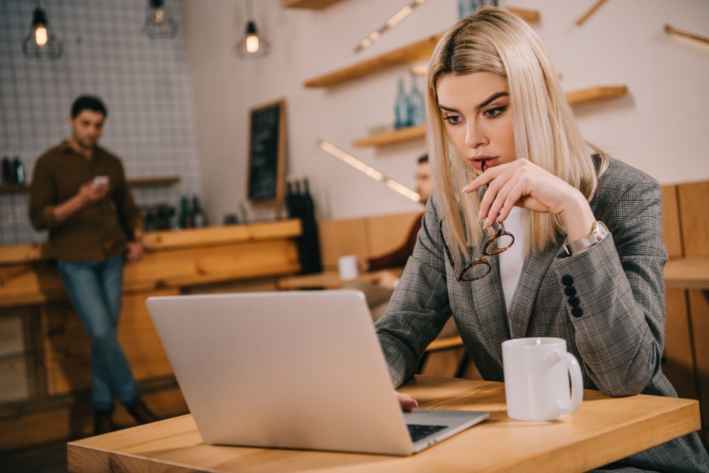 Girl Works On A Laptop Wearing Glasses