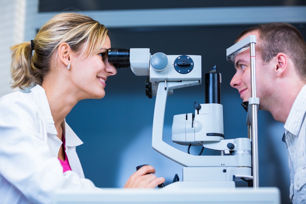 Doctor Inspecting Eye Of A Patient