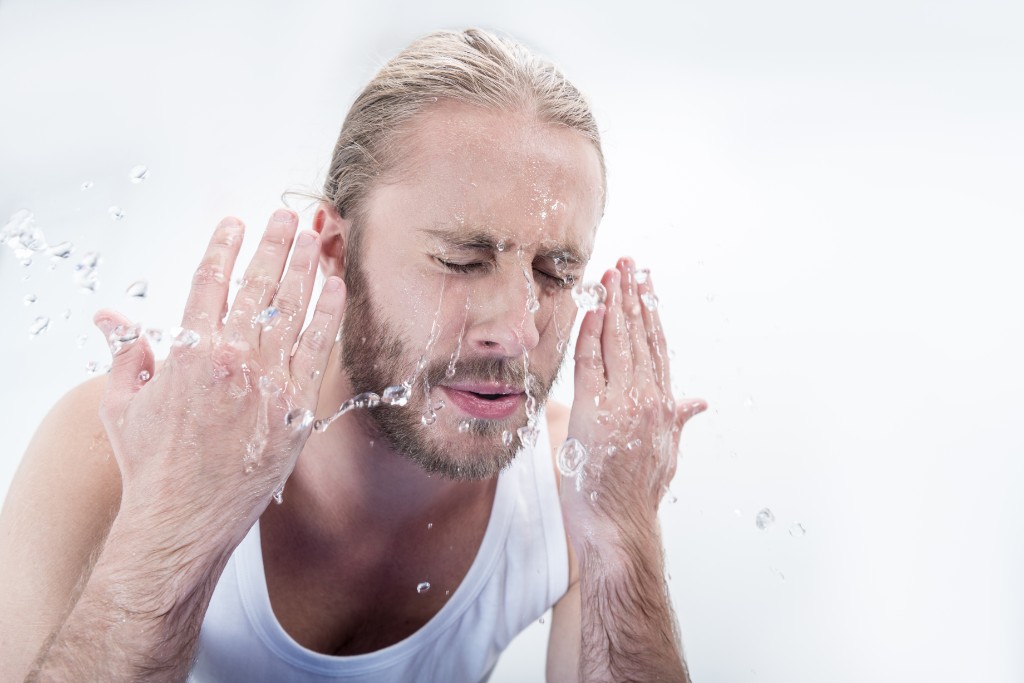 Man Washing His Eye